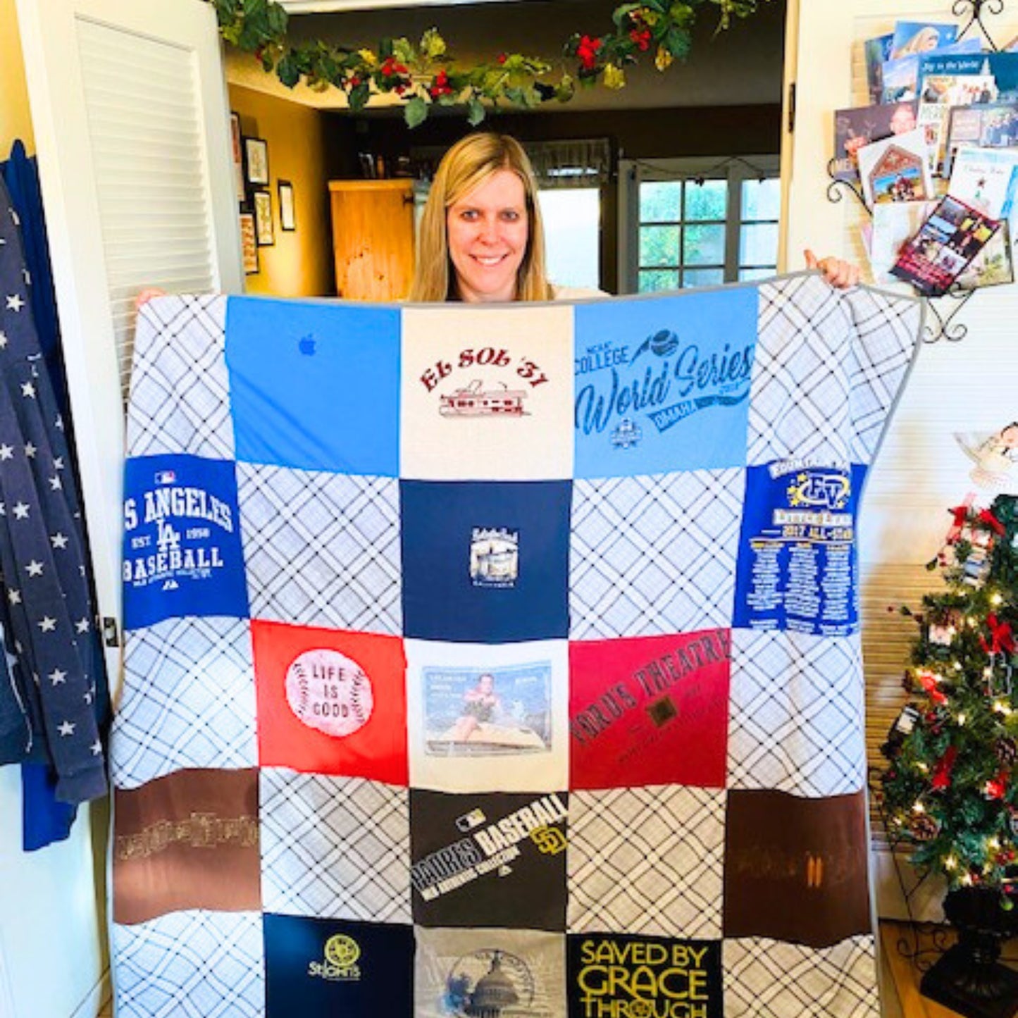 woman holding quilt made of t-shirts