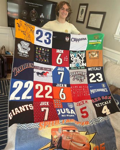 High school graduate man holding unique gift memory blanket made of t-shrits