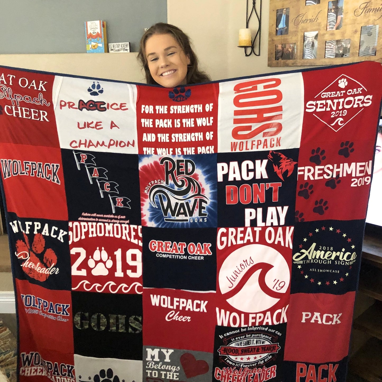 Woman holding custom blanket made of t shirts as a gift